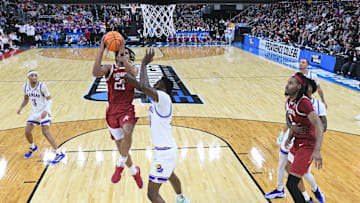 Mar 20, 2025; Providence, RI, USA;  Arkansas Razorbacks guard D.J. Wagner (21) controls the ball against Kansas Jayhawks forward Flory Bidunga (40) during the second half at Amica Mutual Pavilion. Mandatory Credit: Eric Canha-Imagn Images