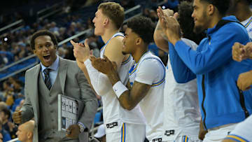 Nov 18, 2025; Los Angeles, California, USA;  UCLA Bruins assistant coach David Singleton reacts along with the bench during the first half against the Sacramento State Hornets at Pauley Pavilion presented by Wescom Financial. Mandatory Credit: Jayne Kamin-Oncea-Imagn Images