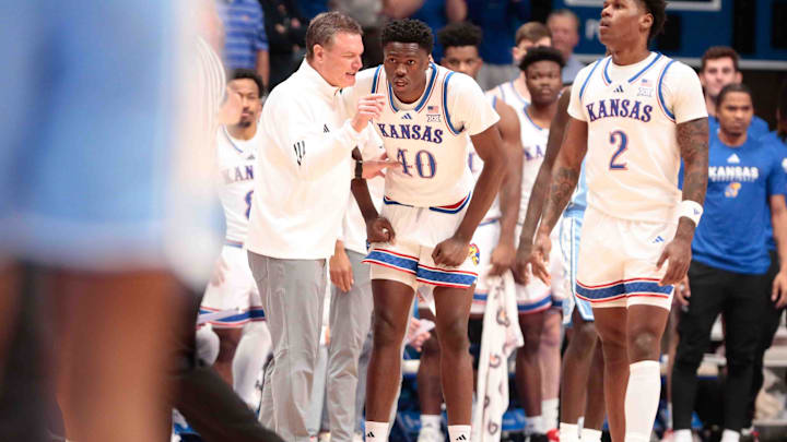 Kansas Jayhawks head coach Bill Self talks with Kansas Jayhawks forward Flory Bidunga (40) in the first half of the game against North Carolina Tar Heels inside Allen Fieldhouse Friday, Nov. 8, 2024.