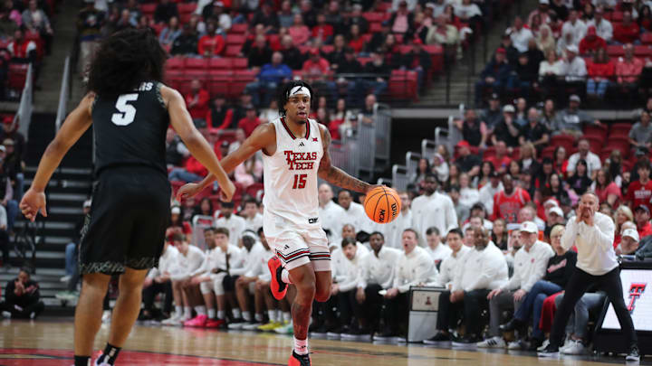 Feb 11, 2026; Lubbock, Texas, USA;  Texas Tech Red Raiders forward JT Toppin (15) brings the ball up court against Colorado Buffaloes guard Josiah Sanders (5) in the first half at United Supermarkets Arena. Mandatory Credit: Michael C. Johnson-Imagn Images