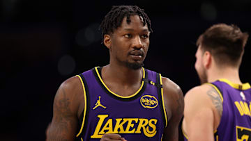 Mar 31, 2025; Los Angeles, California, USA;  Los Angeles Lakers forward Dorian Finney-Smith (17) reacts to a play during the fourth quarter against the Houston Rockets at Crypto.com Arena. Mandatory Credit: Kiyoshi Mio-Imagn Images