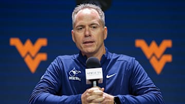 Oct 22, 2024; Kansas City, MO, USA; West Virginia Mountaineers head coach Mark Kellogg talks to media during Big 12 Women’s Basketball Media Day at T-Mobile Center. Mandatory Credit: Jay Biggerstaff-Imagn Images