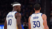 Mar 8, 2025; San Francisco, California, USA; Golden State Warriors forward Jimmy Butler III (10) talks with guard Stephen Curry (30) during a game against the Detroit Pistons in the second quarter at Chase Center. Mandatory Credit: David Gonzales-Imagn Images