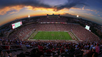 Aerial view of Gaylord Family Oklahoma Memorial Stadium during a night game.