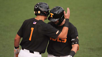 Tennessee's Dean Curley (1) and Levi Clark (30) celebrate Clark's 2-run home during at the NCAA college baseball Knoxville Regional final against Wake Forest on June 1, 2025, in Knoxville, Tenn.