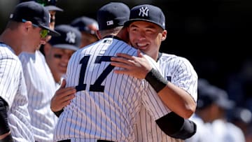 Mar 30, 2023; Bronx, New York, USA; New York Yankees shortstop Anthony Volpe (11) hugs manager Aaron Boone (17) during introductions before an opening day game against the San Francisco Giants at Yankee Stadium. Mandatory Credit: Brad Penner-Imagn Images