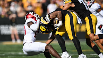 Sep 27, 2025; Iowa City, Iowa, USA; Iowa Hawkeyes running back Kamari Moulton (28) is tackled by Indiana Hoosiers defensive back Ryland Gandy (10) during the second quarter at Kinnick Stadium. Mandatory Credit: Jeffrey Becker-Imagn Images