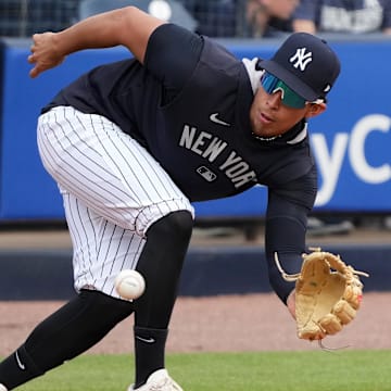 Feb 19, 2025; Tampa, FL, USA; New York Yankees third base Oswaldo Cabrera (95) fields the ball during spring training practice at George M. Steinbrenner Field.