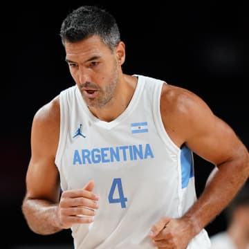 Aug 1, 2021; Saitama, Japan; Argentina player Luis Scola (4) runs down the court after making a three point shot against Japan during the Tokyo 2020 Olympic Summer Games at Saitama Super Arena. Mandatory Credit: Kareem Elgazzar-USA TODAY Sports