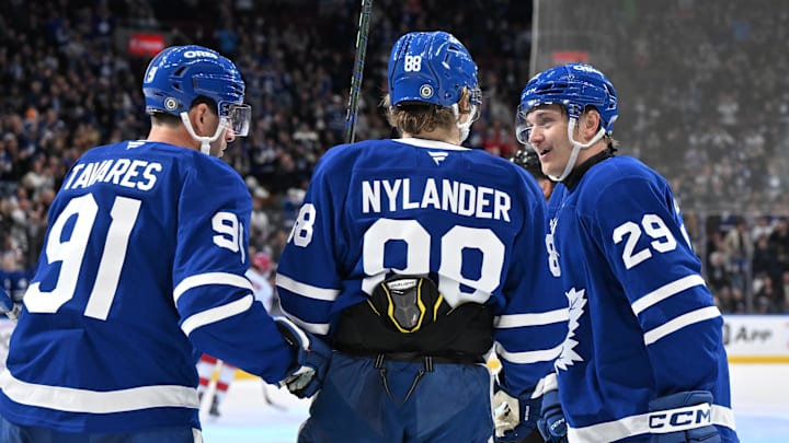 Feb 22, 2025; Toronto, Ontario, CAN;  Toronto Maple Leafs forward Pontus Holmberg (29) celebrates with forwards William Nylander (88) and John Tavares (91) after scoring a goal against the Carolina Hurricanes in the third period at Scotiabank Arena. Mandatory Credit: Dan Hamilton-Imagn Images