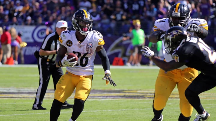 Oct 1, 2017; Baltimore, MD, USA; Pittsburgh Steelers running back LeVeon Bell (26) runs for a gain against the Baltimore Ravens at M&T Bank Stadium. Mandatory Credit: Mitch Stringer-USA TODAY Sports