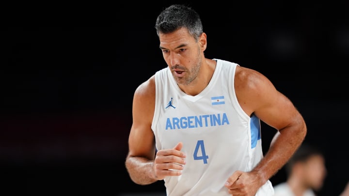 Aug 1, 2021; Saitama, Japan; Argentina player Luis Scola (4) runs down the court after making a three point shot against Japan during the Tokyo 2020 Olympic Summer Games at Saitama Super Arena. Mandatory Credit: Kareem Elgazzar-USA TODAY Sports