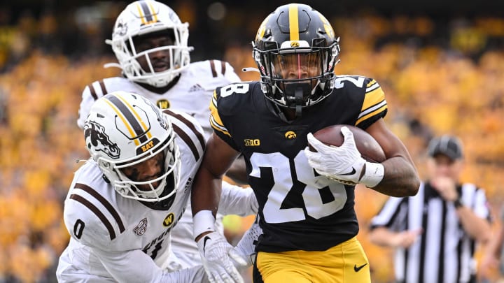 Sep 16, 2023; Iowa City, Iowa, USA; Western Michigan Broncos cornerback DaShon Bussell (0) chases Iowa Hawkeyes running back Kamari Moulton (28) during the third quarter at Kinnick Stadium. Mandatory Credit: Jeffrey Becker-USA TODAY Sports