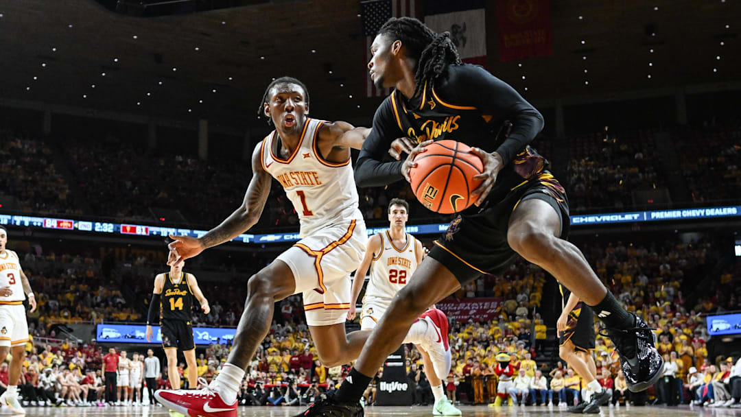 Mar 7, 2026; Ames, Iowa, USA; Arizona State Sun Devils guard Trevor Best (12) is defended by Iowa State Cyclones guard Jamarion Batemon (1) during the second half at James H. Hilton Coliseum. Mandatory Credit: Jeffrey Becker-Imagn Images