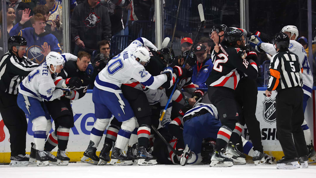 Apr 6, 2026; Buffalo, New York, USA;  The Buffalo Sabres and the Tampa Bay Lightning get in to a scrum after the whistle during the first period at KeyBank Center. Mandatory Credit: Timothy T. Ludwig-Imagn Images