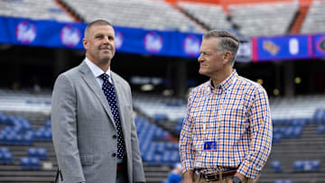 Oct 5, 2024; Gainesville, Florida, USA; Florida Gators head coach Billy Napier and Florida Gators athletic director Scott Stricklin talk before a game against the UCF Knights at Ben Hill Griffin Stadium. Mandatory Credit: Matt Pendleton-Imagn Images