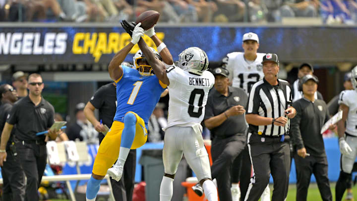 Sep 8, 2024; Inglewood, California, USA; Las Vegas Raiders cornerback Jakorian Bennett (0) breaks up a pass for Los Angeles Chargers wide receiver Quentin Johnston (1) in the first half at SoFi Stadium. Mandatory Credit: Jayne Kamin-Oncea-Imagn Images