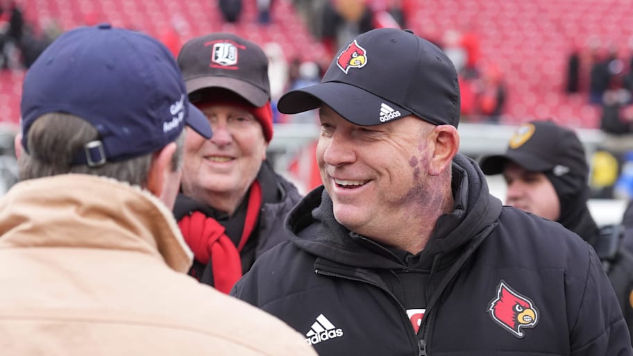 Louisville’s coach Jeff Brohm shook hands with Governor Andy Beshear after winning the Governor’s Cup.