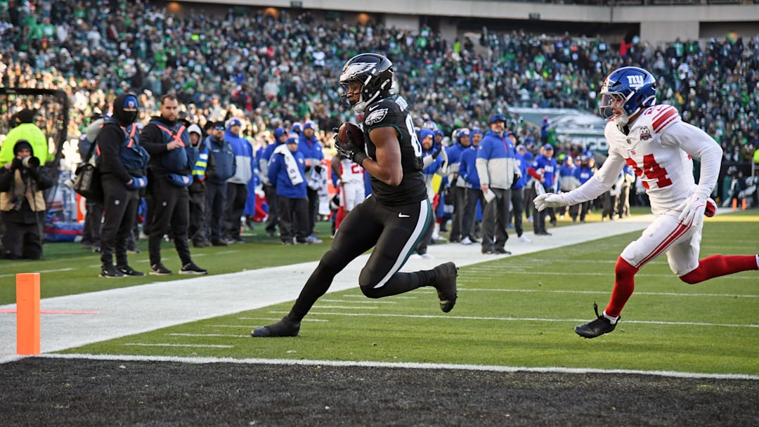 Jan 5, 2025; Philadelphia, Pennsylvania, USA; Philadelphia Eagles tight end E.J. Jenkins (84) catches 7-yard touchdown pass against New York Giants safety Dane Belton (24) during the fourth quarter at Lincoln Financial Field. Mandatory Credit: Eric Hartline-Imagn Images