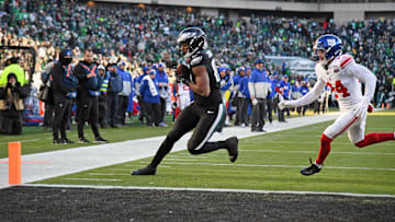 Jan 5, 2025; Philadelphia, Pennsylvania, USA; Philadelphia Eagles tight end E.J. Jenkins (84) catches 7-yard touchdown pass against New York Giants safety Dane Belton (24) during the fourth quarter at Lincoln Financial Field. Mandatory Credit: Eric Hartline-Imagn Images
