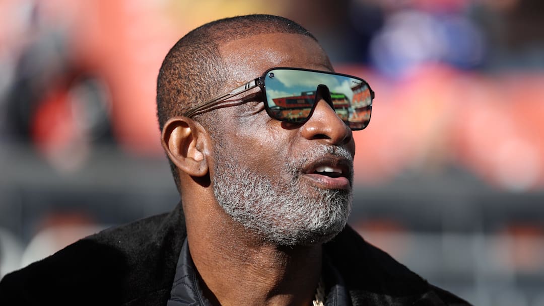 Dec 21, 2025; Cleveland, Ohio, USA;  Legendary  football and baseball player and father of Cleveland Browns quarterback Shedeur Sanders, Deion Sanders on the sidelines prior to a game against the Buffalo Bills at Huntington Bank Field. Mandatory Credit: Scott Galvin-Imagn Images