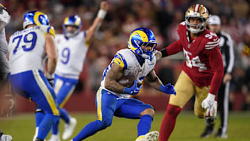 Dec 12, 2024; Santa Clara, California, USA; Los Angeles Rams running back Kyren Williams (23) runs past San Francisco 49ers defensive end Yetur Gross-Matos (94) in the fourth quarter at Levi's Stadium. Mandatory Credit: Cary Edmondson-Imagn Images