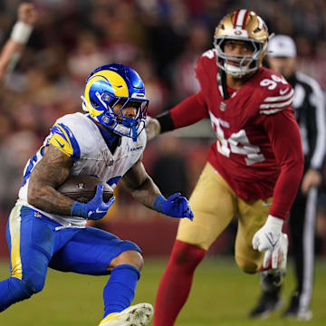 Dec 12, 2024; Santa Clara, California, USA; Los Angeles Rams running back Kyren Williams (23) runs past San Francisco 49ers defensive end Yetur Gross-Matos (94) in the fourth quarter at Levi's Stadium. Mandatory Credit: Cary Edmondson-Imagn Images