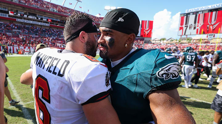Philadelphia Eagles quarterback Jalen Hurts greets Tampa Bay Buccaneers quarterback Baker Mayfield.