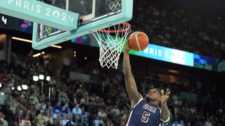 Aug 6, 2024; Paris, France; United States guard Anthony Edwards (5) shoots against Brazil shooting guard Vitor Benite (8) in the first quarter in a men’s basketball quarterfinal game during the Paris 2024 Olympic Summer Games at Accor Arena. Mandatory Credit: Kyle Terada-USA TODAY Sports