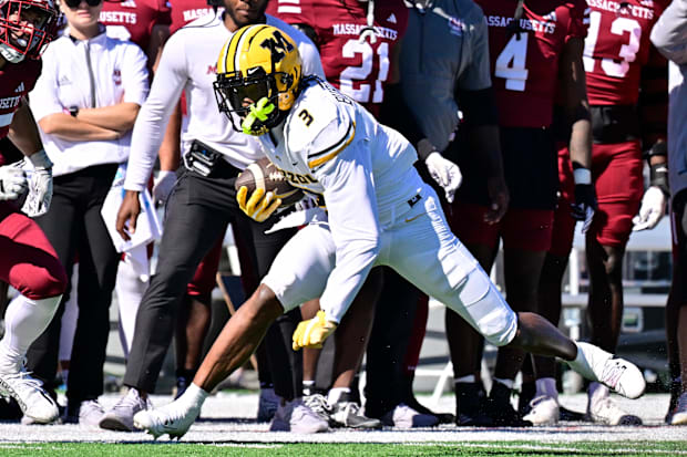 Missouri Tigers wide receiver Luther Burden III runs the ball against the Massachusetts Minutemen.