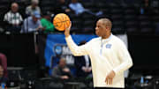 Mar 17, 2025; Dayton, OH, USA; North Carolina Tar Heels head coach Hubert Davis passes the ball during the First Four Practice at UD Arena. Mandatory Credit: Rick Osentoski-Imagn Images