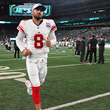 Aug 24, 2024; East Rutherford, New Jersey, USA; New York Giants quarterback Daniel Jones (8) jogs off the field following the game against the New York Jets at MetLife Stadium.  