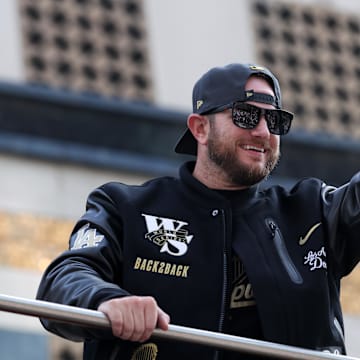 Nov 3, 2025; Los Angeles, CA, USA;  Los Angeles Dodgers third baseman Max Muncy acknowledges the crowd during the World Series championship parade at downtown Los Angeles. Mandatory Credit: Kiyoshi Mio-Imagn Images
