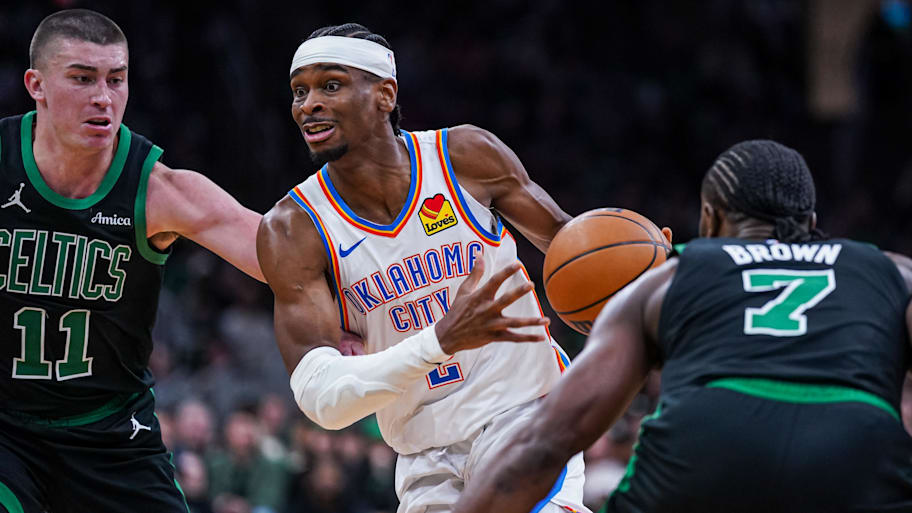 Oklahoma City Thunder guard Shai Gilgeous-Alexander drives the ball against the Boston Celtics.