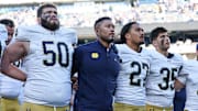 Oct 26, 2024; East Rutherford, New Jersey, USA; Notre Dame Fighting Irish head coach Marcus Freeman sings the Notre Dame alma mater with teammates after the game against the Navy Midshipmen at MetLife Stadium. 