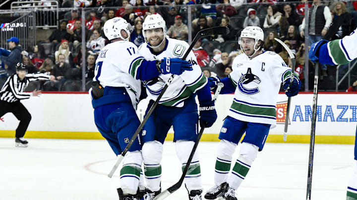 Mar 24, 2025; Newark, New Jersey, USA; Vancouver Canucks left wing Jake DeBrusk (74) reacts after a goal by Vancouver Canucks center Pius Suter (not pictured) during the third period against the New Jersey Devils at Prudential Center. Mandatory Credit: John Jones-Imagn Images Mar 24, 2025; Newark, New Jersey, USA; Vancouver Canucks left wing Jake DeBrusk (74) reacts after a goal by Vancouver Canucks center Pius Suter (not pictured) during the third period against the New Jersey Devils at Prudential Center. Mandatory Credit: John Jones-Imagn Images