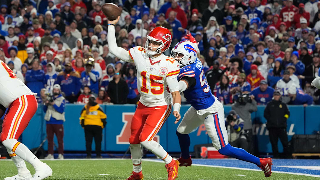Nov 2, 2025; Orchard Park, New York, USA;  Kansas City Chiefs quarterback Patrick Mahomes (15) is pressured to throw by Buffalo Bills defensive end A.J. Epenesa (57) in the second half at Highmark Stadium. Mandatory Credit: Gregory Fisher-Imagn Images