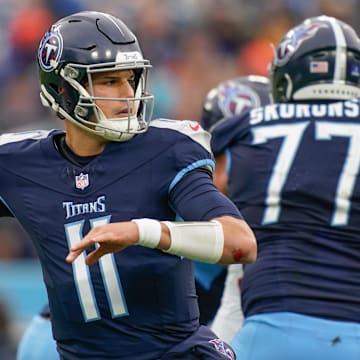 Tennessee Titans quarterback Mason Rudolph (11) looks for a receiver during the third quarter against the Cincinnati Bengals at Nissan Stadium in Nashville, Tenn., Sunday, Dec. 15, 2024.