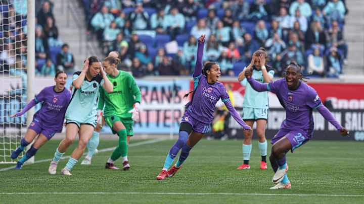 Mar 23, 2025; Harrison, New Jersey, USA; Orlando Pride forward Ally Watt (11) celebrates an own goal past Gotham FC goalkeeper Ann-Katrin Berger (30) during the first half at Sports Illustrated Stadium. Mandatory Credit: Vincent Carchietta-Imagn Images