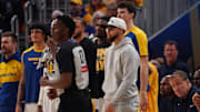 Golden State Warriors guard Stephen Curry watches against the Minnesota Timberwolves during the 2025 NBA Playoffs