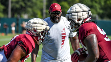 The Crimson Tide players and coaches continue working toward the season opener in practice Tuesday, Aug. 13, 2024. Alabama defensive line coach Freddie Roach works his players.