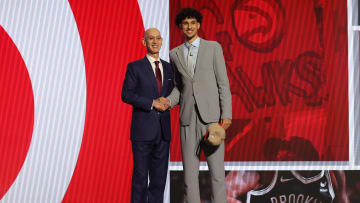 Zaccharie Risacher poses with NBA commissioner Adam Silver after being selected first overall by the Atlanta Hawks in the first round of the 2024 NBA draft.