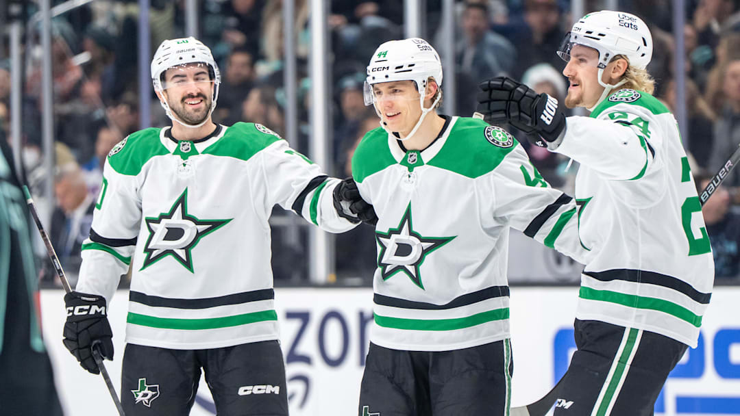 Nov 26, 2025; Seattle, Washington, USA; Dallas Stars, from left, defenseman Kyle Capobianco (20), defenseman Vladislav Kolyachonok (44) and forward Roope Hintz (24) celebrate a goal during the third period at Climate Pledge Arena. Mandatory Credit: Stephen Brashear-Imagn Images