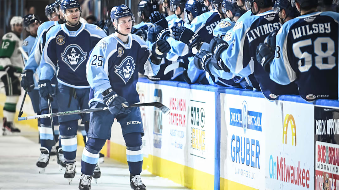 Teammates congratulate Milwaukee Admirals right wing Joakim Kemell (25) on his goal during the first period of their game Saturday, February 10, 2024, at the UW-Milwaukee Panther Arena in Milwaukee, Wisconsin.