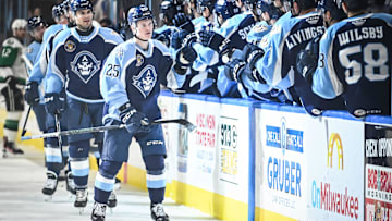 Teammates congratulate Milwaukee Admirals right wing Joakim Kemell (25) on his goal during the first period of their game Saturday, February 10, 2024, at the UW-Milwaukee Panther Arena in Milwaukee, Wisconsin.