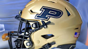 A Purdue Boilermakers helmet sits ready on the bench