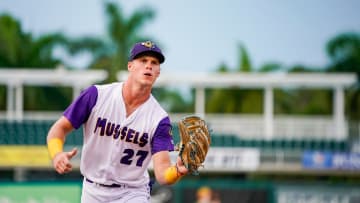 Fort Myers Mighty Mussels outfielder Walker Jenkins (27) catches a ball from the dugout during the second inning of a game against the Tampa Tarpons at Hammond Stadium in Fort Myers on Friday, June 28, 2024.