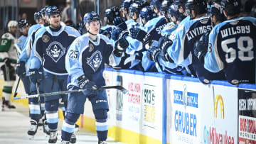 Teammates congratulate Milwaukee Admirals right wing Joakim Kemell (25) on his goal during the first period of their game Saturday, February 10, 2024, at the UW-Milwaukee Panther Arena in Milwaukee, Wisconsin.