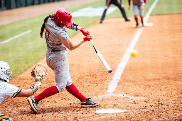 Nebraska shortstop Ava Kuszak launches a grand slam home run against Southeastern Louisiana in the Baton Rouge Regional.