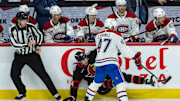 Apr 11, 2025; Ottawa, Ontario, CAN; Ottawa Senators center Dylan Cozens (24) is checked by Montreal Canadiens defenseman Jayden Struble (47) in the third period at the Canadian Tire Centre. Mandatory Credit: Marc DesRosiers-Imagn Images